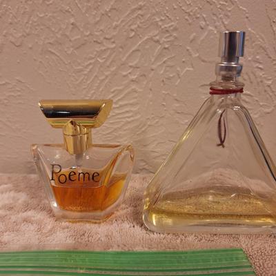 2 bottles of fragrance  1.  Lancôme Poême Eau de Parfum. And 2.  Lix Claiborn Triangle Eau De Toilette