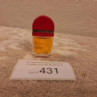 miniature bottle of Elizabeth Arden Red Door perfume.