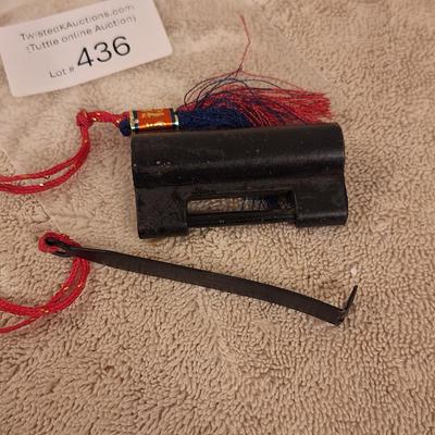  vintage Chinese traditional-style padlock and key with a tassel.