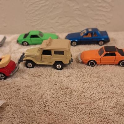 vintage diecast toy cars, some are lesney and tomica and one or two may be hotwheels.