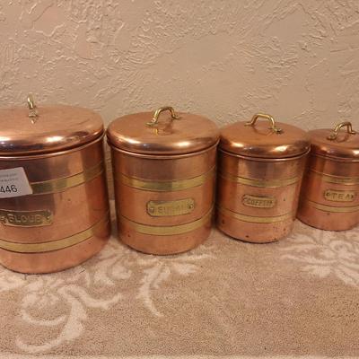 vintage set of four coppoer kitchen canisters with brass handles