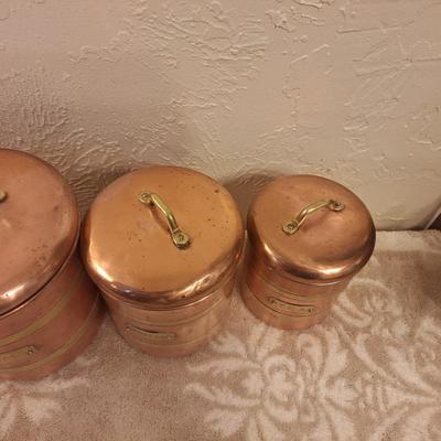 vintage set of four coppoer kitchen canisters with brass handles