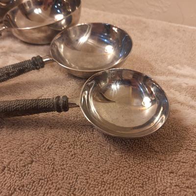 Not sure…they seem to be measuring cups but have no markings, they are heavier than typical as well.