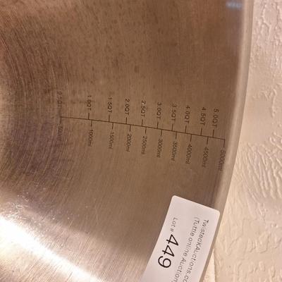 Oneida stainless steel mixing bowl with measurement lines on inside.