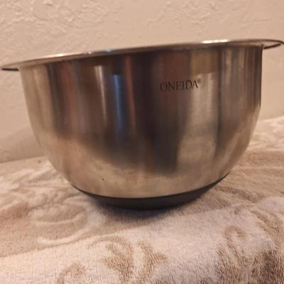 Oneida stainless steel mixing bowl with measurement lines on inside.