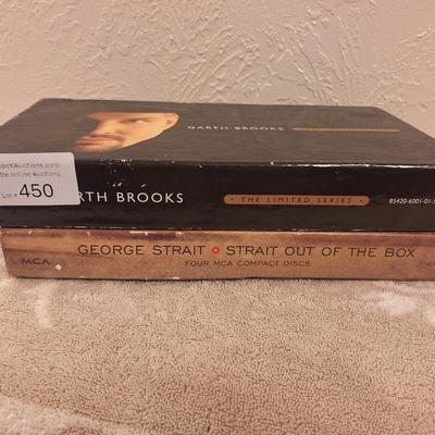 CD sets for Garth Brooks and George Straight.  5 CDs for Garth, 4 for George