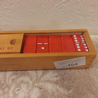 Vintage set of red Supreme brand double six dominoes in wooden box
