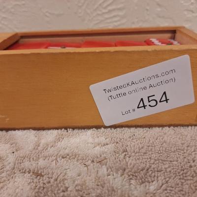 Vintage set of red Supreme brand double six dominoes in wooden box