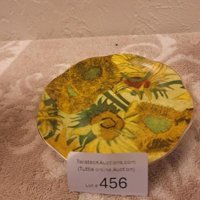 two porcelain teacups and saucers featuring prints of Vincent van Gogh paintings.   The Sower and The Starry Night