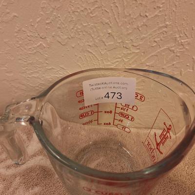 Anchor Hocking 2-cup (16-ounce) glass measuring cup and a metal flour sifter.