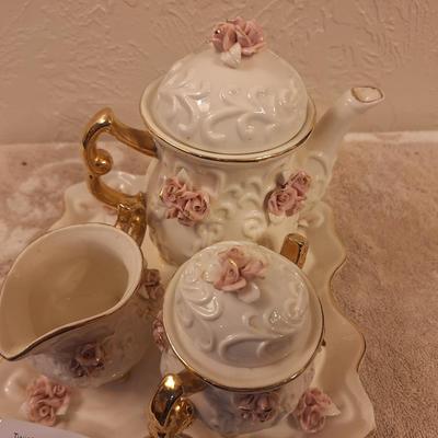  Cracker Barrel vintage ivory porcelain tea set featuring a delicate pink rose motif and 10K gold trim plating