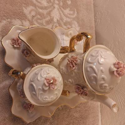  Cracker Barrel vintage ivory porcelain tea set featuring a delicate pink rose motif and 10K gold trim plating