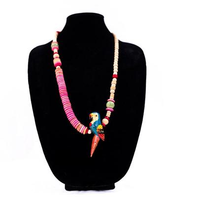 Sale Photo Thumbnail #417: This is a vintage hand- carved wood parrot beaded necklace.