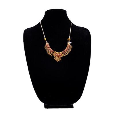 Sale Photo Thumbnail #439: This is a multicolor stone-studded traditional Indian necklace, possibly a kundan or jadau style, with matching turquoise and red bead necklace visible in the background.