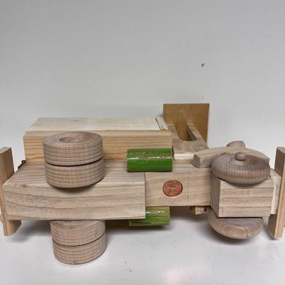 HAND CRAFTED WOODEN TOYS WITH AN EMBEDDED PENNY FOR DATE MADE