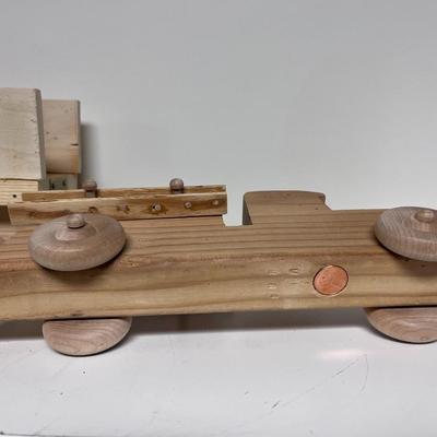 HAND CRAFTED WOODEN TOYS WITH AN EMBEDDED PENNY FOR DATE MADE