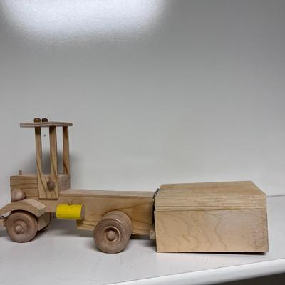 HAND CRAFTED WOODEN TOYS WITH AN EMBEDDED PENNY FOR DATE MADE