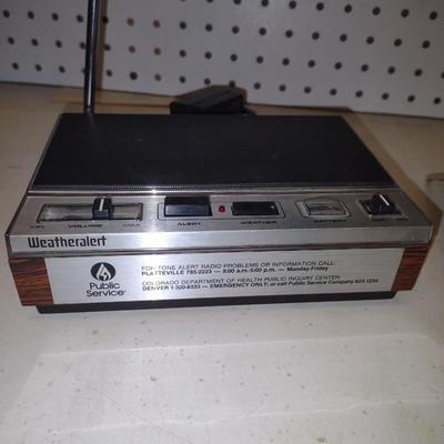SYLVANIA TRANSISTOR RADIO AND A WEATHER ALERT