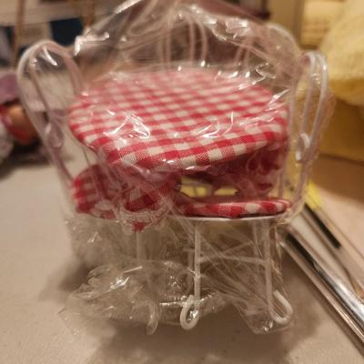 White and Red Checkered Table and Chairs