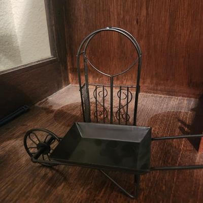 Black Metal Arch and Wheelbarrow