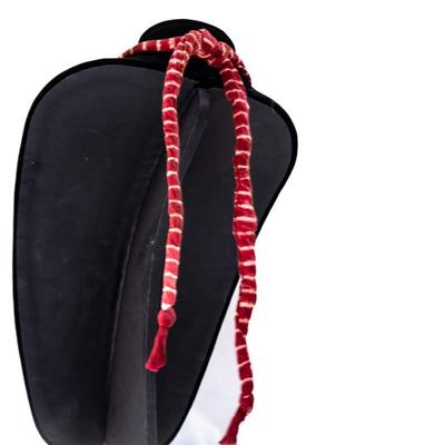 Sale Photo Thumbnail #450: This is a handcrafted charm neckace featuring a hand-dyed scarf base approximately 56 milagros and charchkas from around the world.