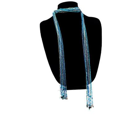 Sale Photo Thumbnail #462: This is a multistrand seed bead necklace in shades of blue, green, and white.