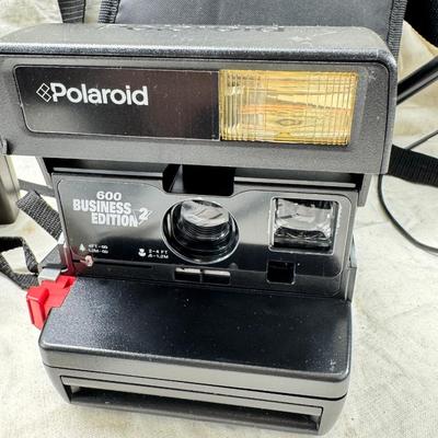 Sale Photo Thumbnail #387: All untested  1 Land camera with case, 2 One step Polaroids, one with brown leather case. 2 Instamatic Kodaks one with some used film inside. Extra gear flashes in an original box.   This is a Tokina RMC 80-200mm f/4 telephoto zoom lens. It is a manual fo