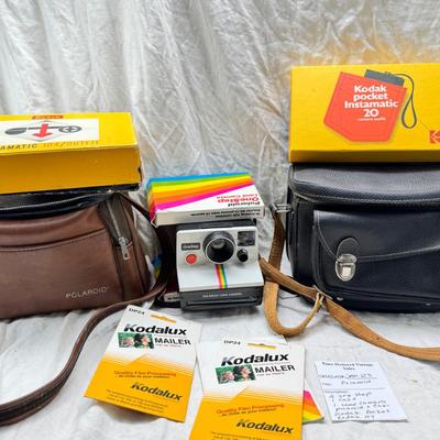 Sale Photo Thumbnail #385: All untested  1 Land camera with case, 2 One step Polaroids, one with brown leather case. 2 Instamatic Kodaks one with some used film inside. Extra gear flashes in an original box.   This is a Tokina RMC 80-200mm f/4 telephoto zoom lens. It is a manual fo