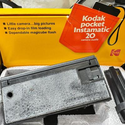 Sale Photo Thumbnail #383: All untested  1 Land camera with case, 2 One step Polaroids, one with brown leather case. 2 Instamatic Kodaks one with some used film inside. Extra gear flashes in an original box.   This is a Tokina RMC 80-200mm f/4 telephoto zoom lens. It is a manual fo