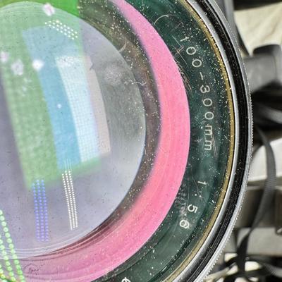 Sale Photo Thumbnail #394: All untested  1 Land camera with case, 2 One step Polaroids, one with brown leather case. 2 Instamatic Kodaks one with some used film inside. Extra gear flashes in an original box.   This is a Tokina RMC 80-200mm f/4 telephoto zoom lens. It is a manual fo