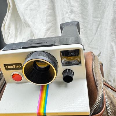 Sale Photo Thumbnail #381: All untested  1 Land camera with case, 2 One step Polaroids, one with brown leather case. 2 Instamatic Kodaks one with some used film inside. Extra gear flashes in an original box.   This is a Tokina RMC 80-200mm f/4 telephoto zoom lens. It is a manual fo