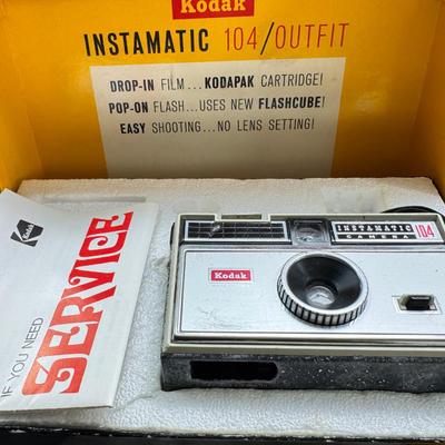 Sale Photo Thumbnail #379: All untested  1 Land camera with case, 2 One step Polaroids, one with brown leather case. 2 Instamatic Kodaks one with some used film inside. Extra gear flashes in an original box.   This is a Tokina RMC 80-200mm f/4 telephoto zoom lens. It is a manual fo