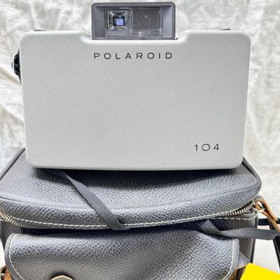 Sale Photo Thumbnail #377: All untested  1 Land camera with case, 2 One step Polaroids, one with brown leather case. 2 Instamatic Kodaks one with some used film inside. Extra gear flashes in an original box.   This is a Tokina RMC 80-200mm f/4 telephoto zoom lens. It is a manual fo