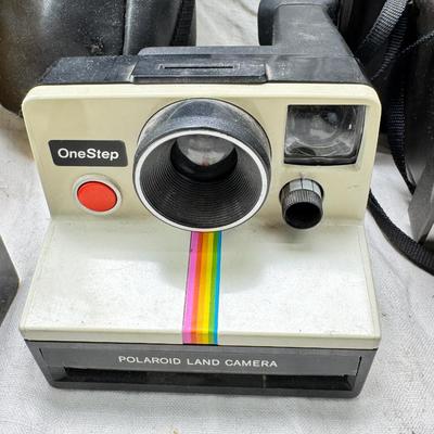 Sale Photo Thumbnail #390: All untested  1 Land camera with case, 2 One step Polaroids, one with brown leather case. 2 Instamatic Kodaks one with some used film inside. Extra gear flashes in an original box.   This is a Tokina RMC 80-200mm f/4 telephoto zoom lens. It is a manual fo