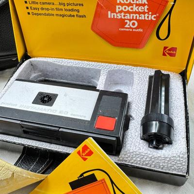 Sale Photo Thumbnail #376: All untested  1 Land camera with case, 2 One step Polaroids, one with brown leather case. 2 Instamatic Kodaks one with some used film inside. Extra gear flashes in an original box.   This is a Tokina RMC 80-200mm f/4 telephoto zoom lens. It is a manual fo