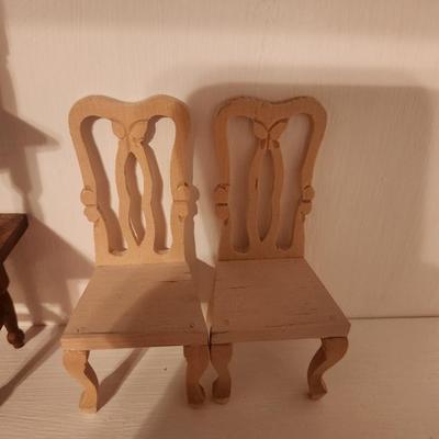 2 Light Colored Wood Chairs