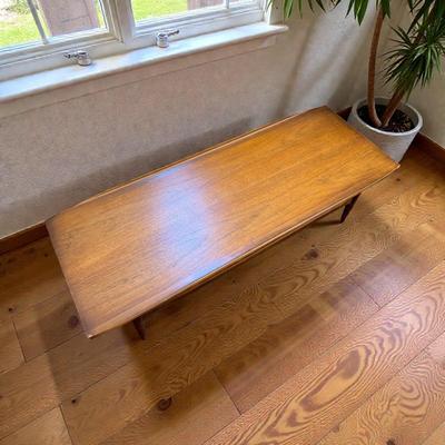 Bassett Artisan Collection MCM Walnut Surfboard Coffee Table with a Spindled Lower Shelf