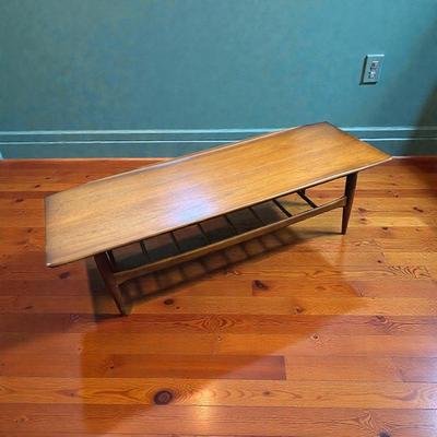 Bassett Artisan Collection MCM Walnut Surfboard Coffee Table with a Spindled Lower Shelf