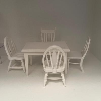 White wooden doll house table
