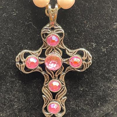 Pink cross and purple butterfly pendants