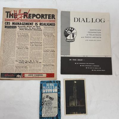 Sale Photo Thumbnail #250: In good vintage condition.
The image displays a collection of vintage entertainment industry memorabilia, including: 
A copy of The Hollywood Reporter newspaper from February 10, 1966, with headlines like "CBS MANAGEMENT IS REALIGNED" and "Paramount Stock