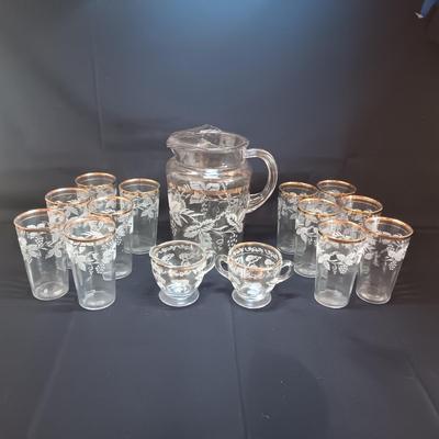 BARTLETT COLLINS 12 GLASS TUMBLERS, PITCHER AND CRREAM/SUGAR SET WITH ETCHED GRAPEVINE PATTERN AND GOLD TRIM