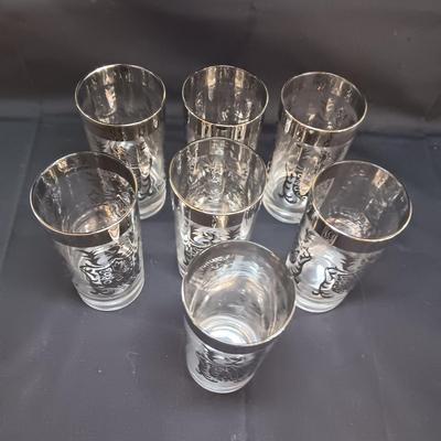 SEET OF MID-CENTURY KIMIKO SILVER KNIGHT SHIELD HIGHBALL GLASSES AND 4 METAL CANDLE HOLDERS