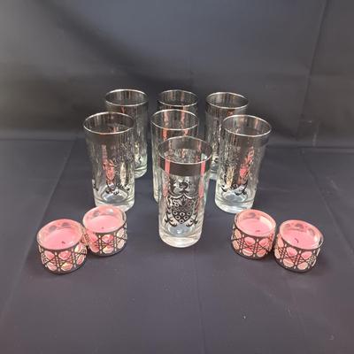 SEET OF MID-CENTURY KIMIKO SILVER KNIGHT SHIELD HIGHBALL GLASSES AND 4 METAL CANDLE HOLDERS
