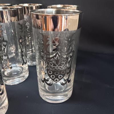 SEET OF MID-CENTURY KIMIKO SILVER KNIGHT SHIELD HIGHBALL GLASSES AND 4 METAL CANDLE HOLDERS