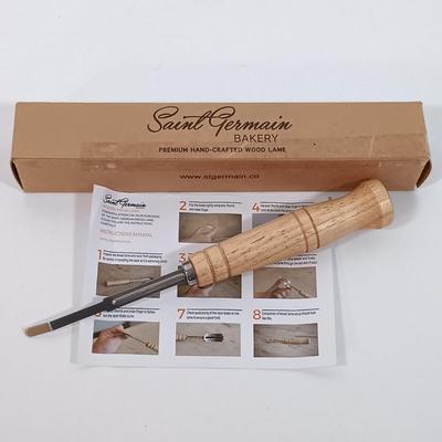 LOT 25: Longaberger Pottery Woven Traditions Bundt Pan, Kirk & Matz Sheffield Carving Knife and Fork, Pampered Chef Easy Accent...