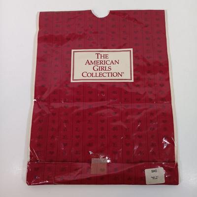 LOT 27: American Girl Molly's School Story Dress and Samantha's Summer Story Dress with Dollie & Me Dress