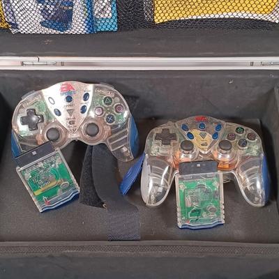 LOT 30: PlayStation 2 Console with Case and Accessories