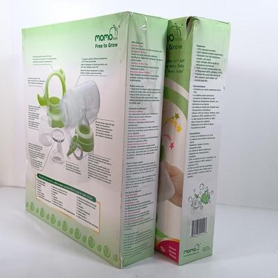 LOT 38: NIB Set of (2) Momo Baby Silcone Bottle Gift Sets