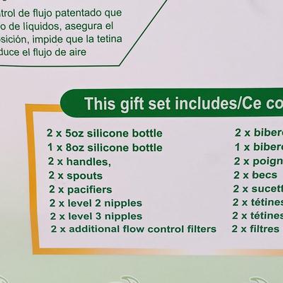 LOT 38: NIB Set of (2) Momo Baby Silcone Bottle Gift Sets